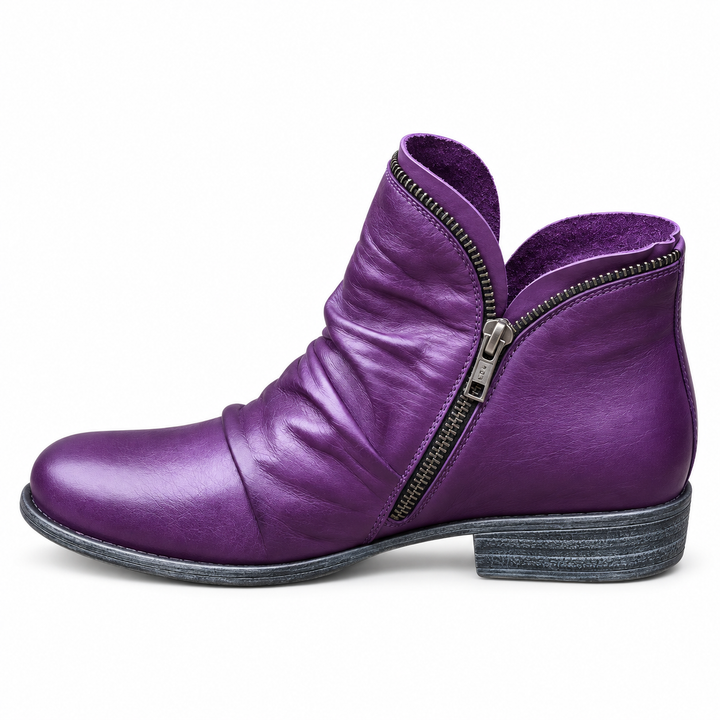 Corinne Bennett and Lowe round-toe ankle boots in black leather with low heel and sleek design, displayed on a white background.
