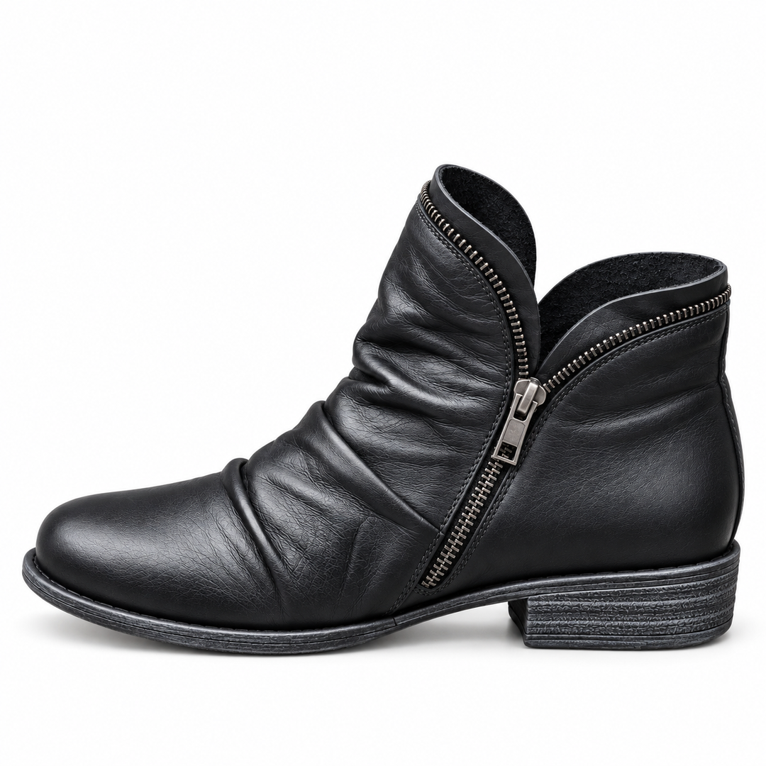 Corinne Bennett and Lowe round-toe ankle boots in black leather, featuring a sleek design and low heel for everyday wear.