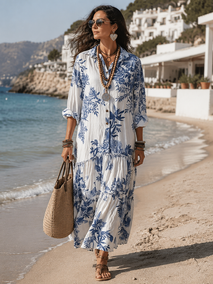 Blue floral button-down maxi dress for women by Bennett and Lowe, featuring a flowing silhouette and vibrant floral pattern.