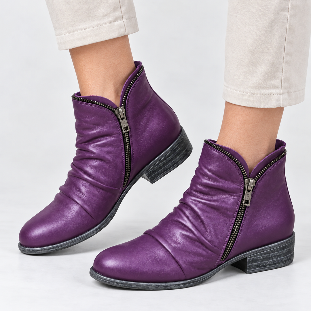 Corinne Bennett and Lowe round-toe ankle boots in black leather with low block heels, stylish and versatile for everyday wear.