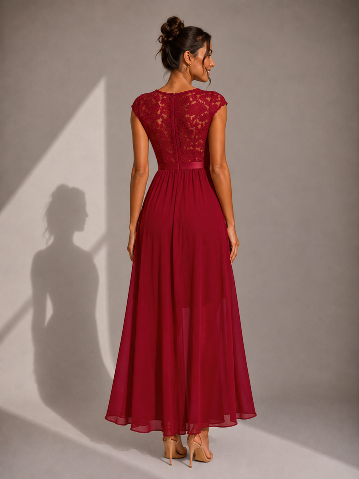 Lace bodice high-low maxi dress by Bennett and Lowe featuring elegant lace details and flowing fabric.