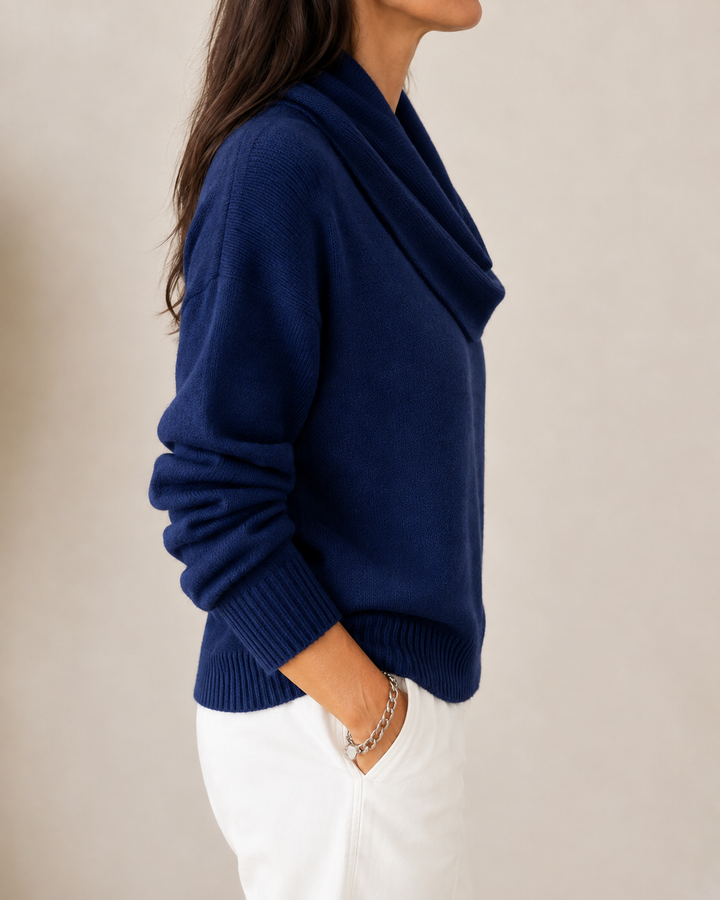 Soft cowl neck jumper by Bennett and Lowe, featuring a cozy fit and ribbed knit texture in a neutral color.