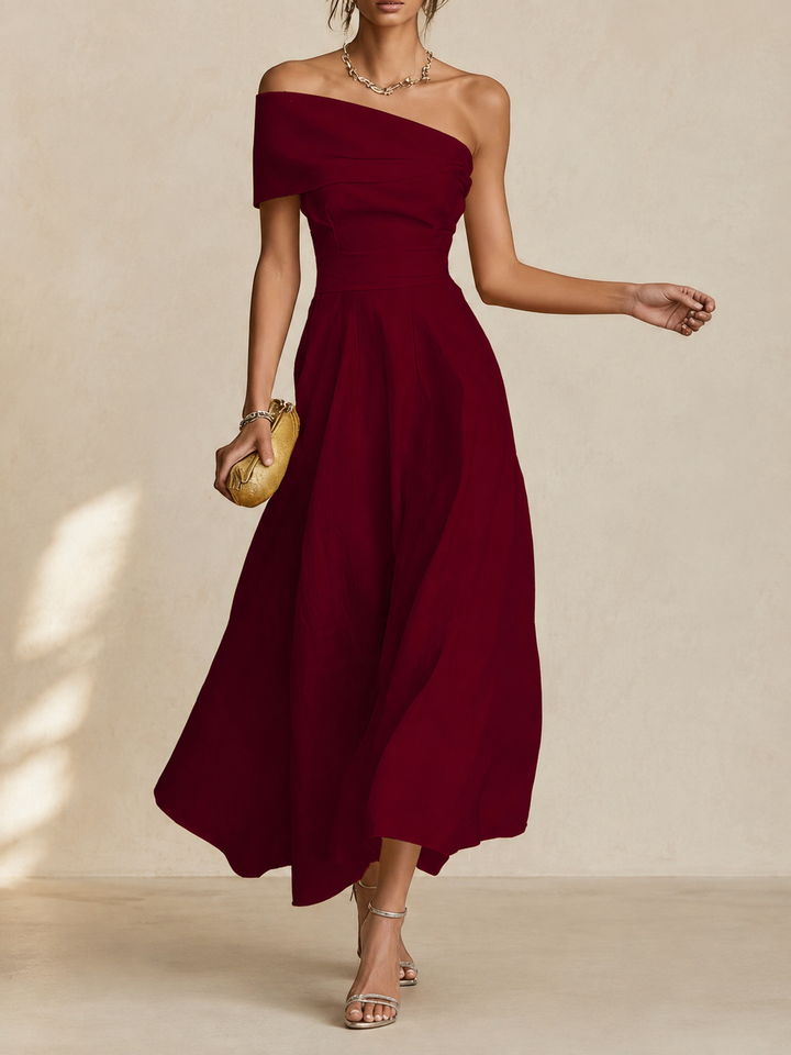 Wenda Bennett & Lowe maxi dress in flowing fabric with a floral pattern, sleeveless design, and V-neck style.