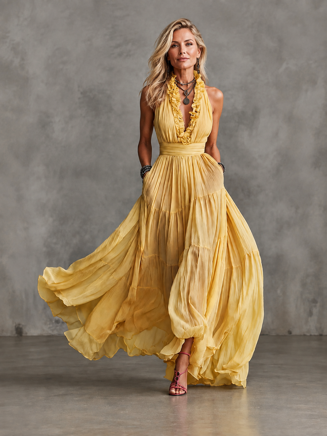 Delphine backless maxi dress by Bennett and Lowe with pleats and ruffle trim, flowing elegant evening dress.