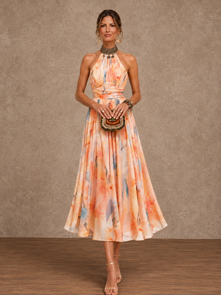 Lily Bennett and Lowe halter maxi dress with watercolor print, flowing fabric, and elegant design perfect for summer events.