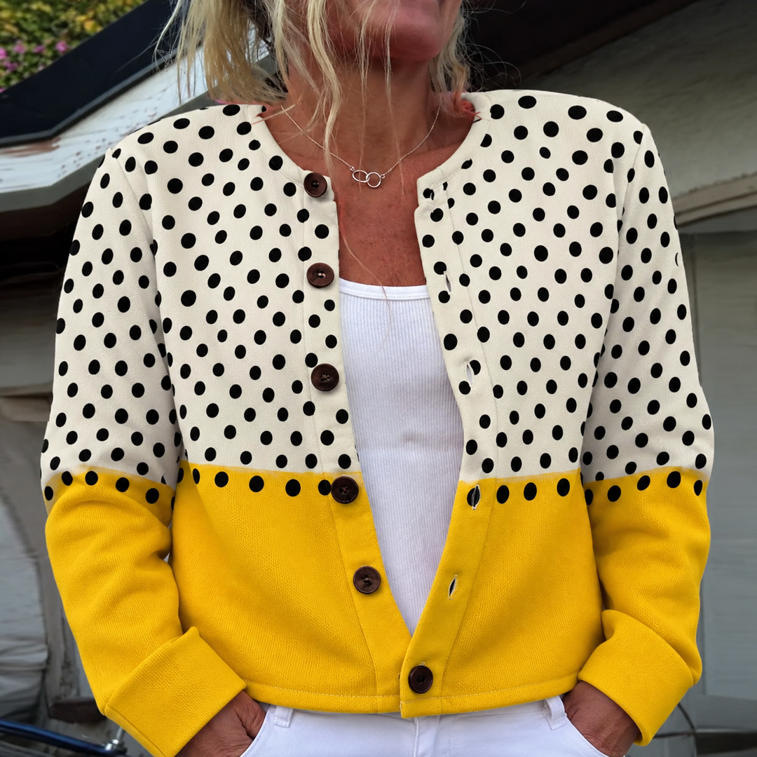 Two-tone knit cardigan by Bennett and Lowe featuring a cozy design and button-up front, styled in neutral and dark hues.