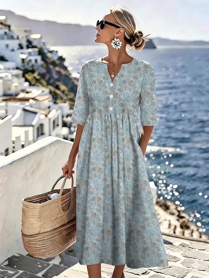 Floral summer midi dress for women by Bennett & Lowe, featuring a flowing design and vibrant floral pattern.