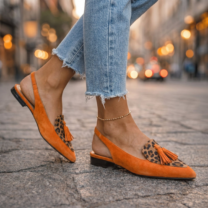 Eliza handwoven tassel flat sandals by Bennett and Lowe, featuring woven straps and decorative tassels for a boho-chic look.