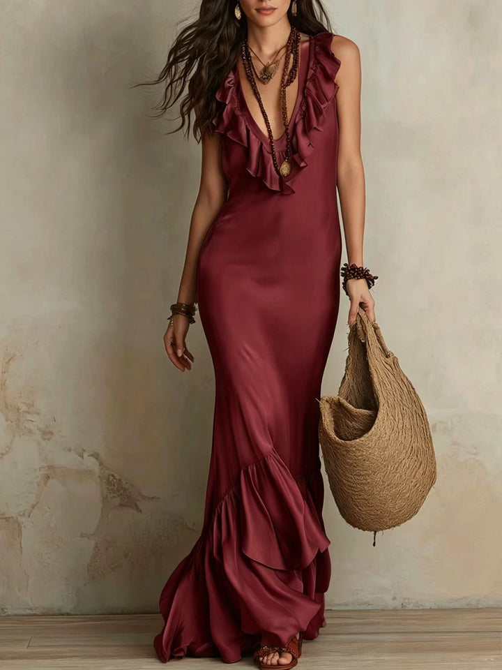 Isadora Bennett and Lowe tiered ruffle mermaid hem maxi dress in elegant fabric, flowing design, and layered ruffle details.