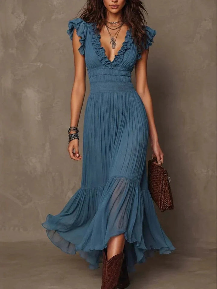 Florence ruffle maxi dress by Bennett and Lowe displayed on a hanger with flowing fabric and detailed ruffle accents.