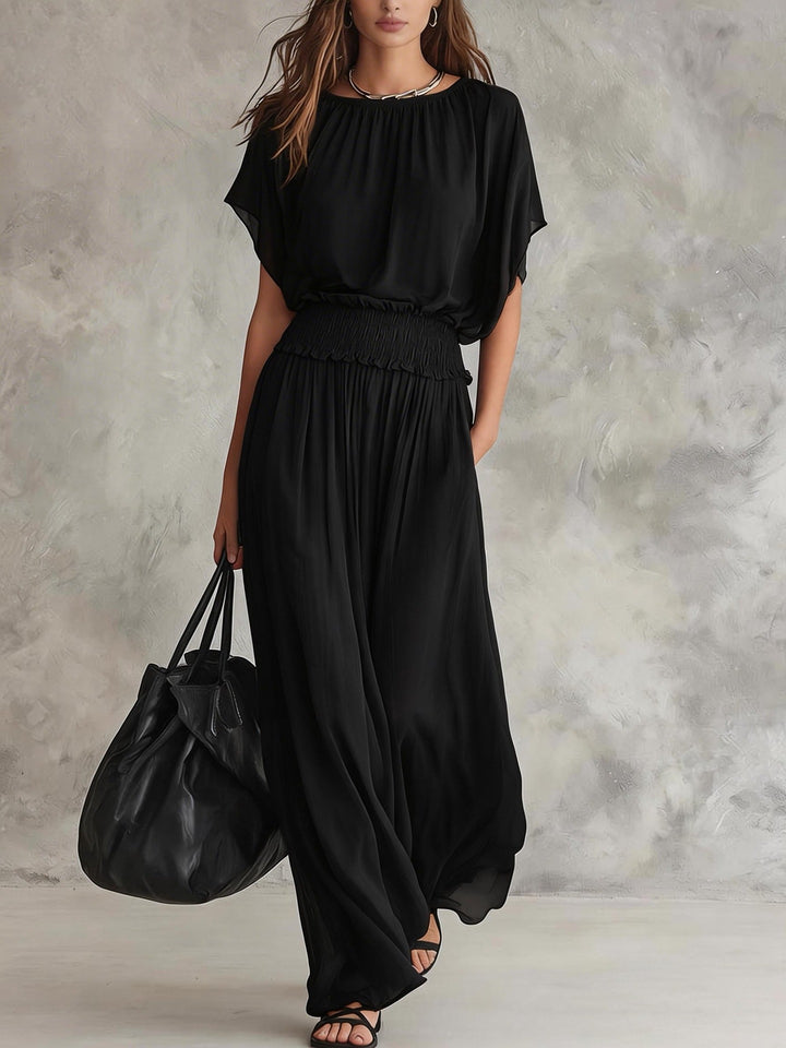 Romi wide-leg set by Bennett and Lowe featuring draped fabric, high waist, and flowing silhouette in neutral tones.