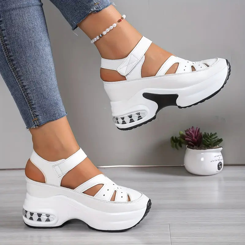 Bennett and Lowe Odile cutout platform wedge sneakers in black, side view