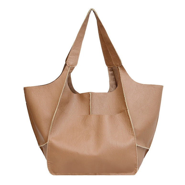 Bennett and Lowe Ruth pebbled leather tote bag with adjustable strap, showcasing its textured surface and spacious interior.