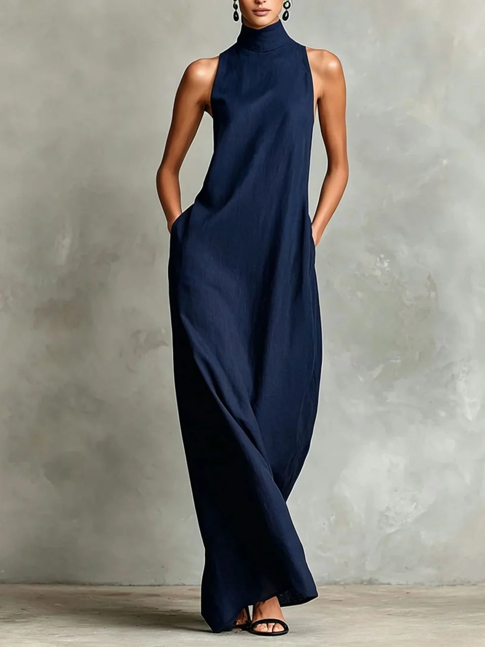 Chrissy high-neck pocket maxi dress by Bennett and Lowe, shown in a full-length view with front pockets and flowing fabric.