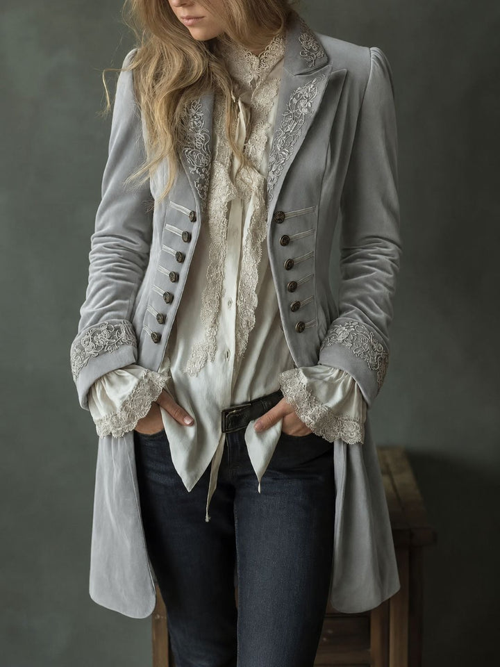 Marissa Bennett and Lowe embroidered double-breasted coat with intricate floral embroidery and tailored fit, shown on model.
