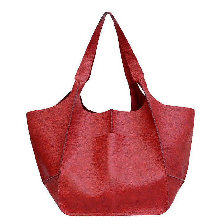 Bennett and Lowe Ruth pebbled leather tote bag with adjustable strap, showcasing its textured leather and sleek design.
