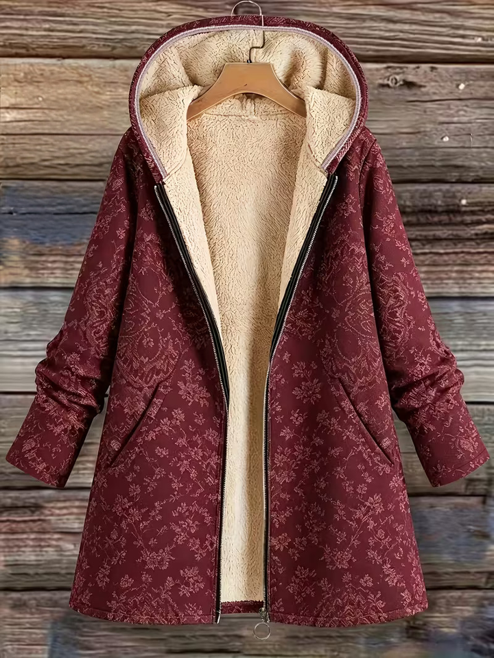 Eileen floral hooded longline coat by Bennett & Lowe, shown with a floral pattern, hood, and longline silhouette.