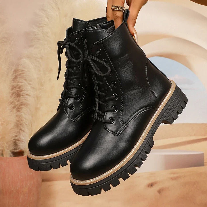 Bennett and Lowe Brisa lace-up platform combat boots with chunky soles and black leather finish.