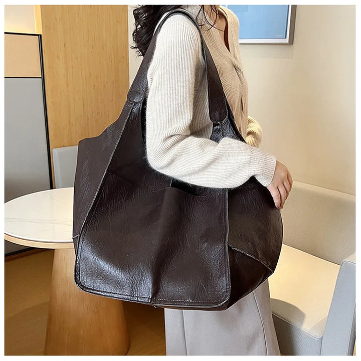 Bennett and Lowe Ruth pebbled leather tote bag with adjustable strap, showcasing its textured surface and elegant design.