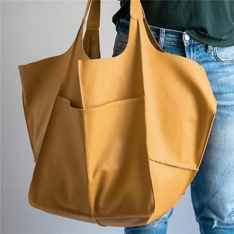 Bennett and Lowe Ruth pebble leather tote bag with adjustable strap, showing its textured leather surface and sleek design.