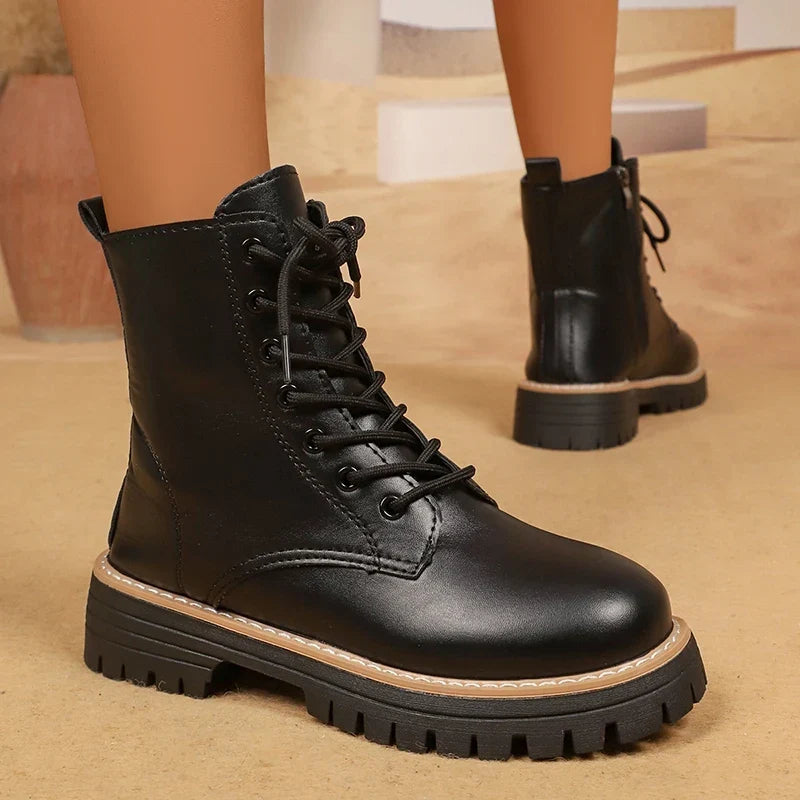 Bennett and Lowe Brisa lace-up platform combat boots with chunky soles and black leather finish, showcasing their stylish design.
