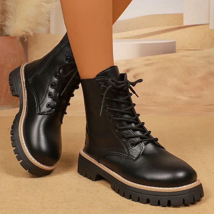 Bennett and Lowe Brisa lace-up platform combat boots with chunky soles and black leather finish.
