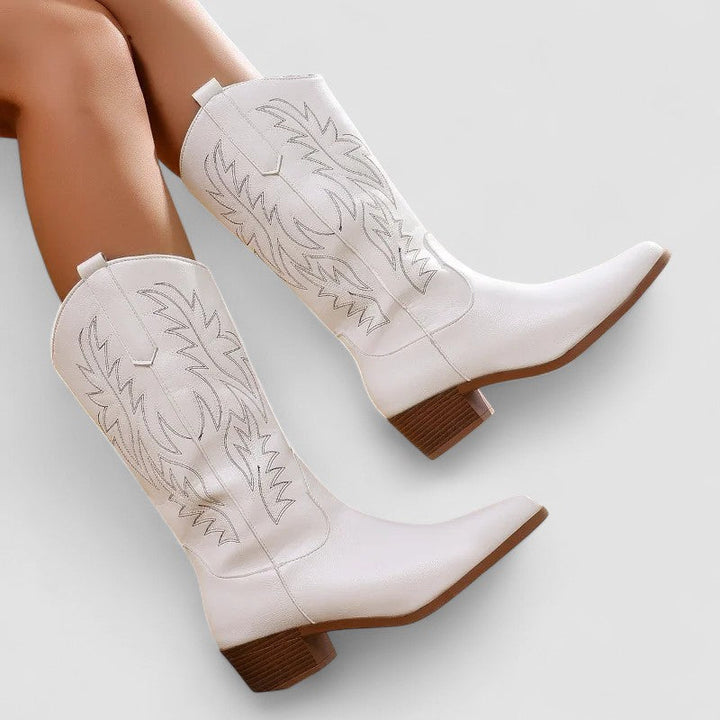 Women’s embroidered Western cowboy boots by Bennett and Lowe featuring intricate floral embroidery and classic leather design.