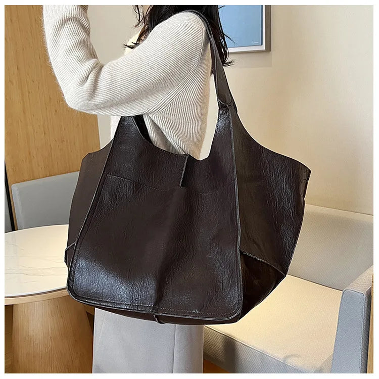 Bennett and Lowe Ruth pebble leather tote bag with adjustable strap, showing its textured leather surface and sleek tote design.