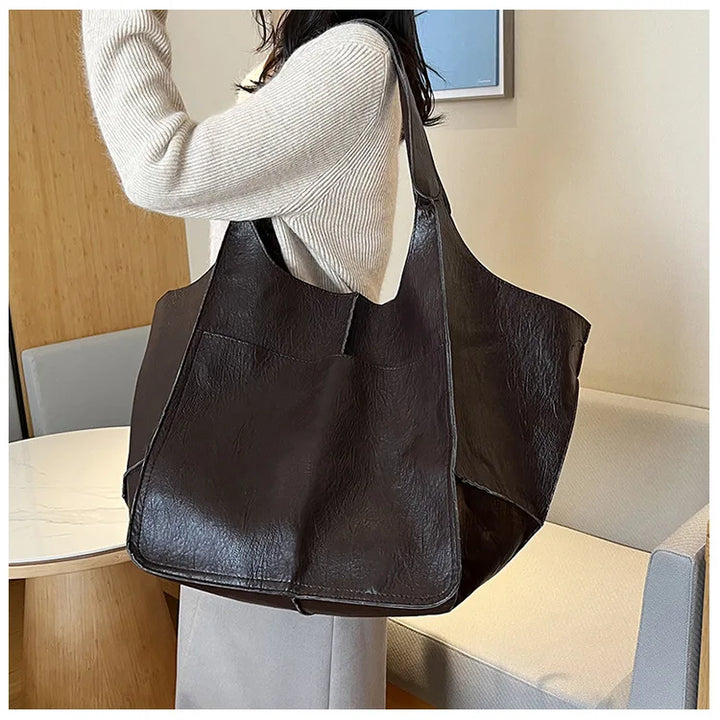 Bennett and Lowe Ruth pebble leather tote bag with adjustable strap, showing its textured leather surface and sleek tote design.