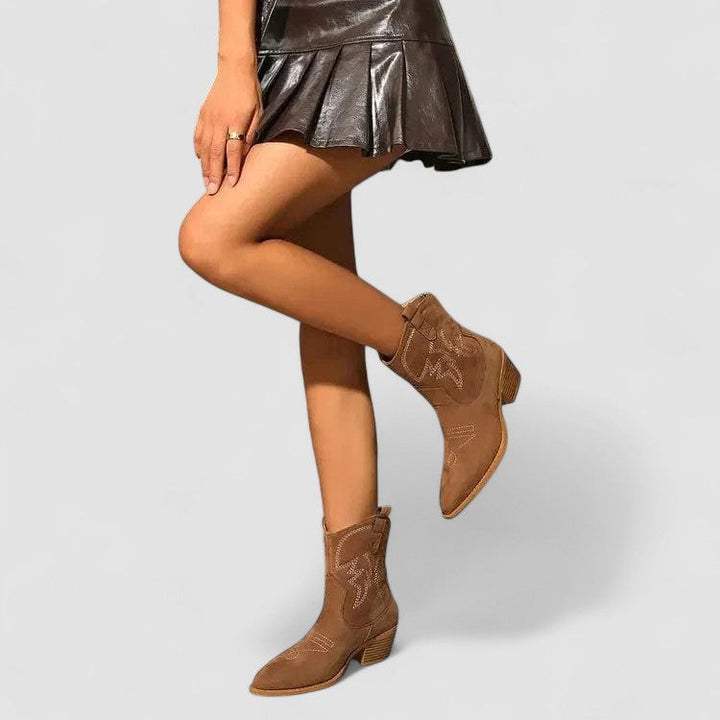 Lillian Bennett and Lowe women's buckle ankle boot featuring a sleek silhouette and stylish buckle detail.