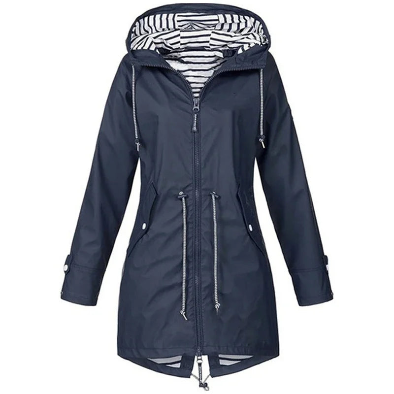 Victoria Bennett & Lowe drawstring hooded outdoor trench coat shown in beige with functional pockets and adjustable waist.