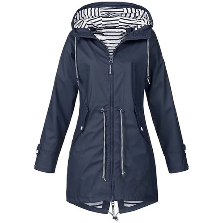 Victoria Bennett & Lowe drawstring hooded outdoor trench coat shown in beige with functional pockets and adjustable waist.