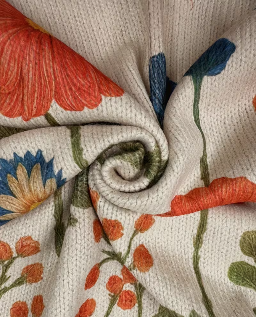Wrenna Wildflower Meadow Zip Cardigan for Women by Bennett and Lowe, featuring colorful floral pattern and front zipper detail.