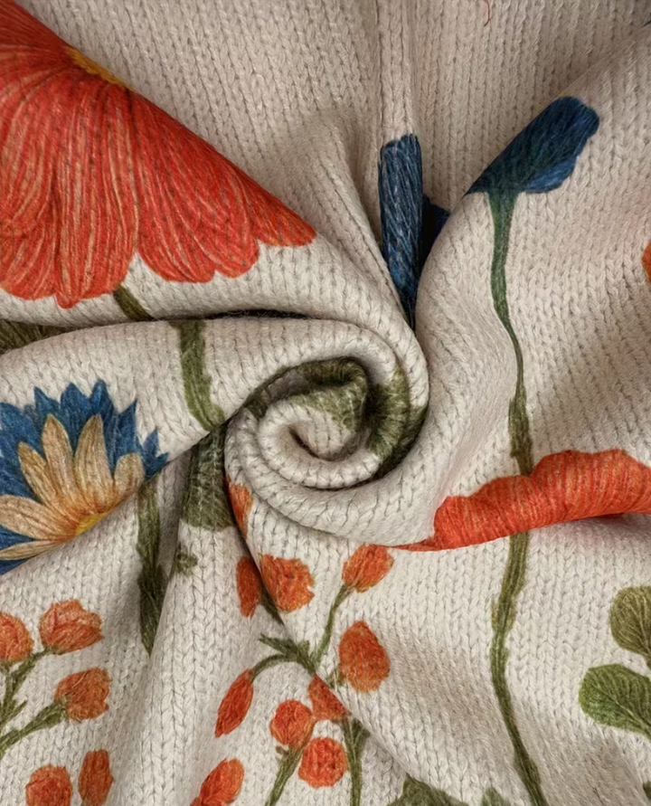 Wrenna Wildflower Meadow Zip Cardigan for Women by Bennett and Lowe, featuring colorful floral pattern and front zipper detail.