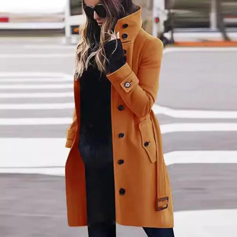 Bennett & Lowe Monica slim fit long sleeve coat hanging on a wooden hanger, showcasing tailored design and dark color.