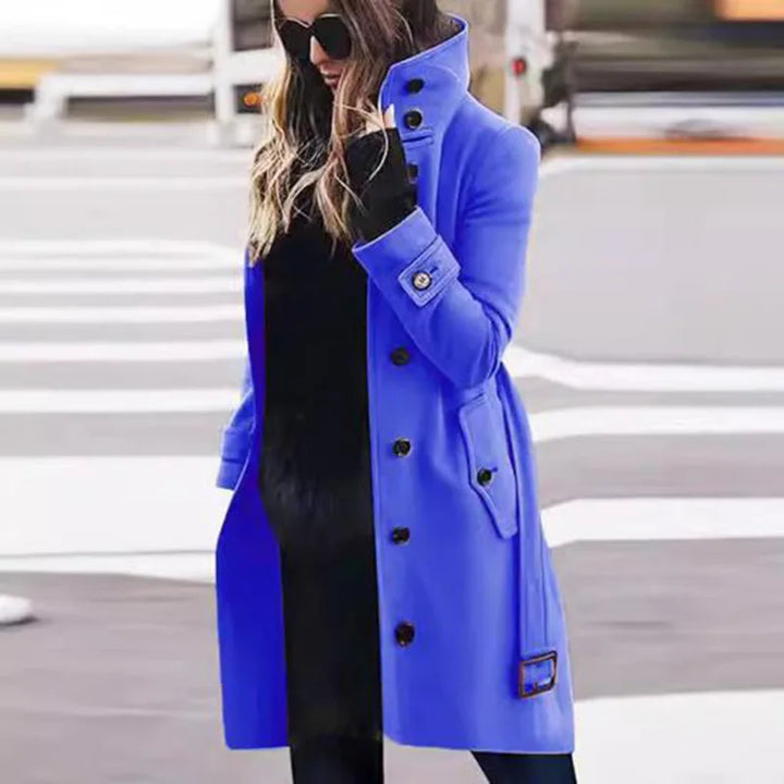 Bennett & Lowe Monica slim fit long sleeve coat hanging on a wooden hanger, showcasing tailored design and dark fabric.