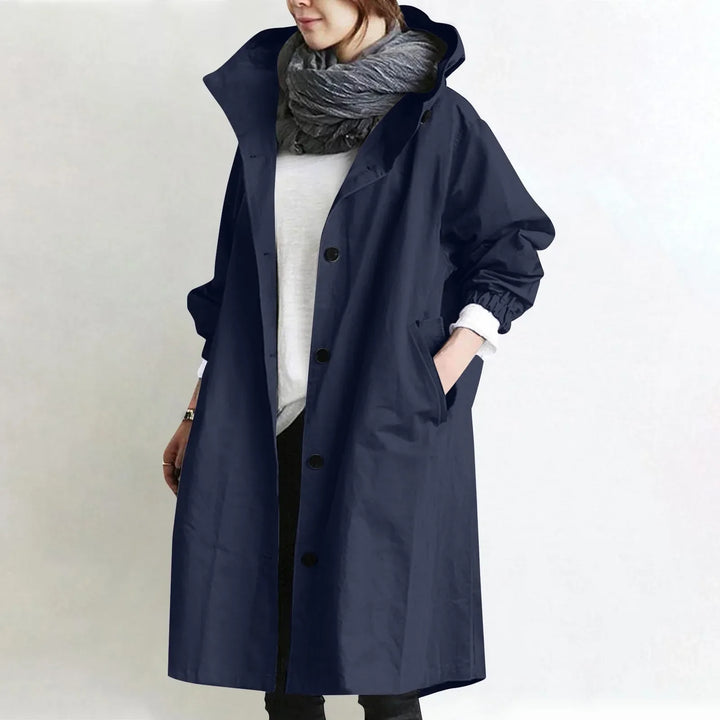 Eloise hooded longline trench coat by Bennett and Lowe, shown in black with a waist belt and classic trench design.