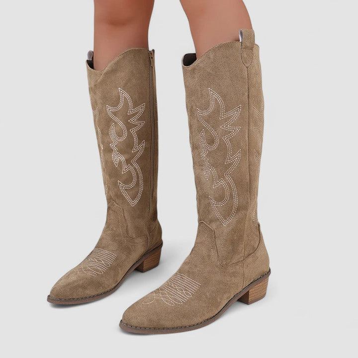 Bennett and Lowe Clara wide-calf knee-high boots for women, featuring a sleek design and comfortable fit, shown on a model.