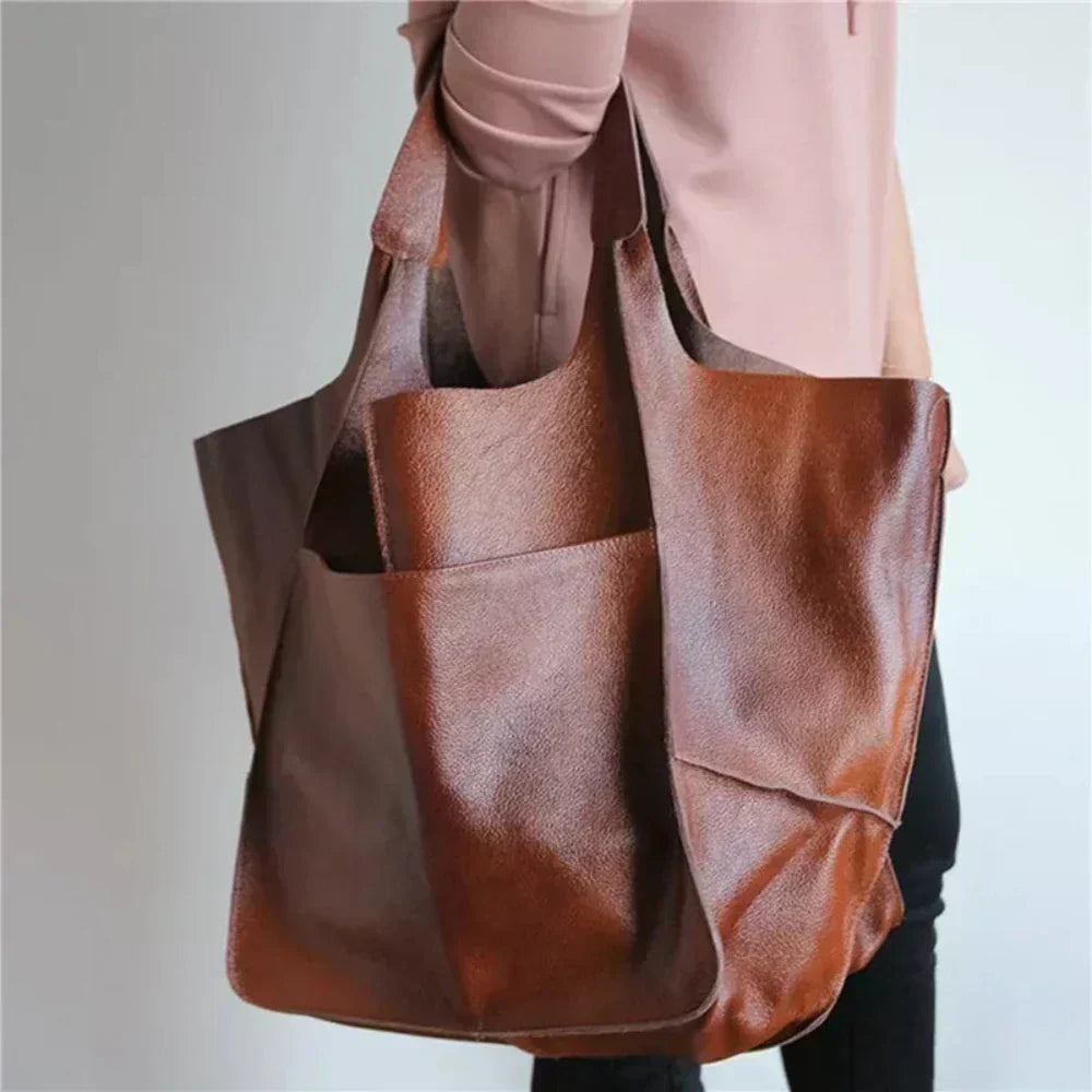 Bennett and Lowe Ruth pebble leather tote bag with adjustable strap, featuring a spacious interior and stylish design.