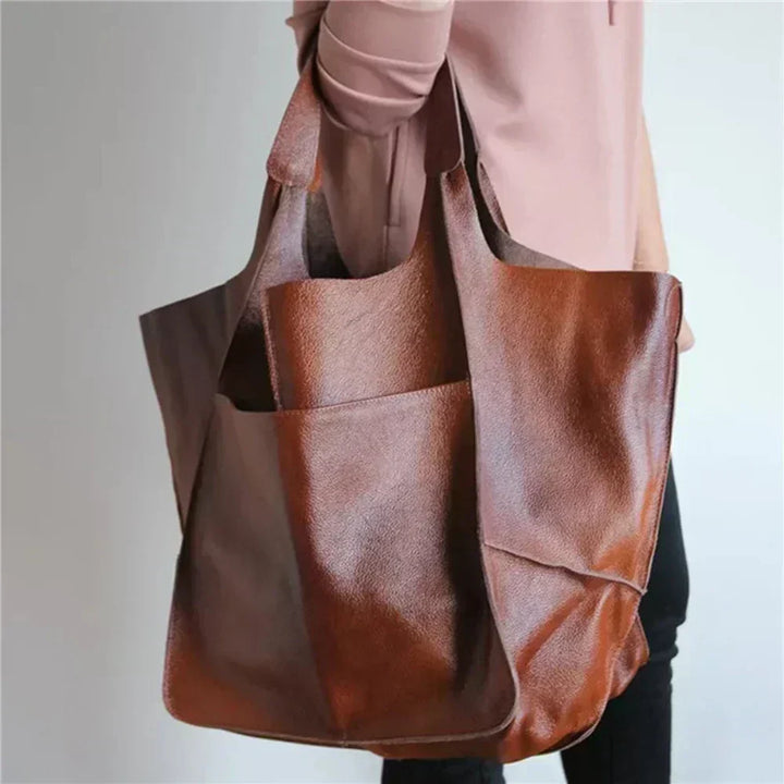 Bennett and Lowe Ruth pebble leather tote bag with adjustable strap, featuring a spacious interior and stylish design.