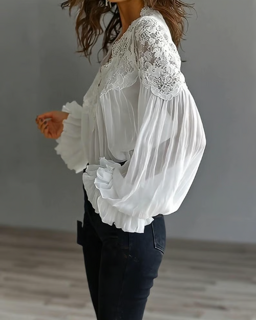 Elegant floral lace blouse with scalloped V-neck and lantern sleeves by Bennett and Lowe, featuring intricate lace details.