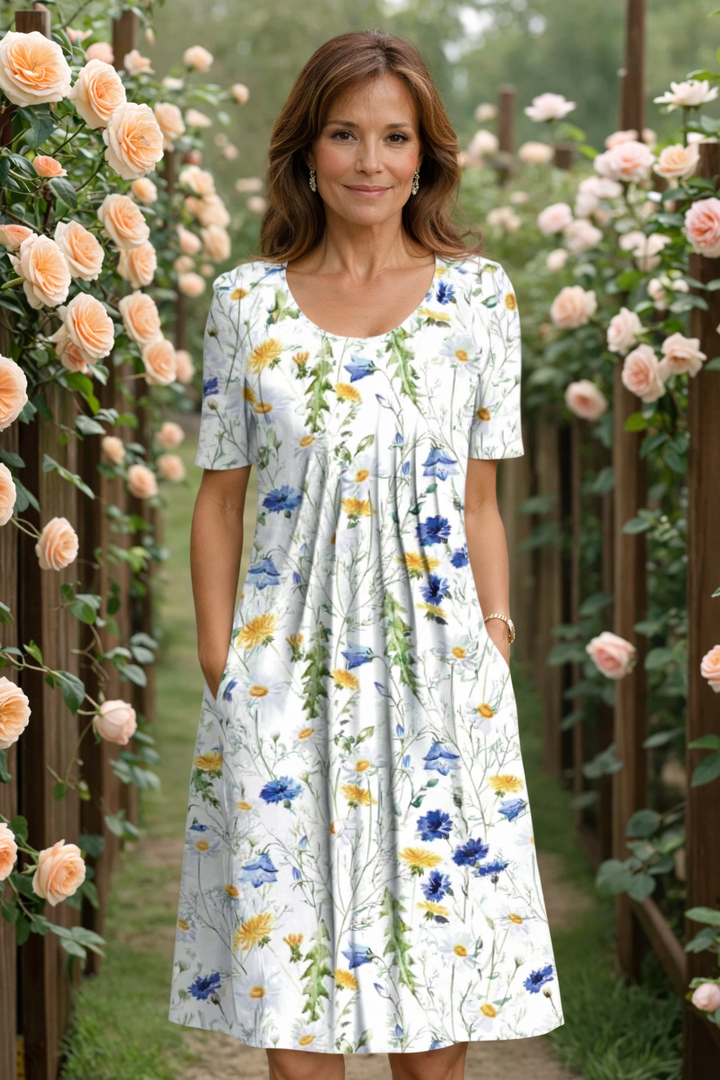 Elegant floral midi dress by Bennett and Lowe featuring a woman in a blooming rose garden setting.
