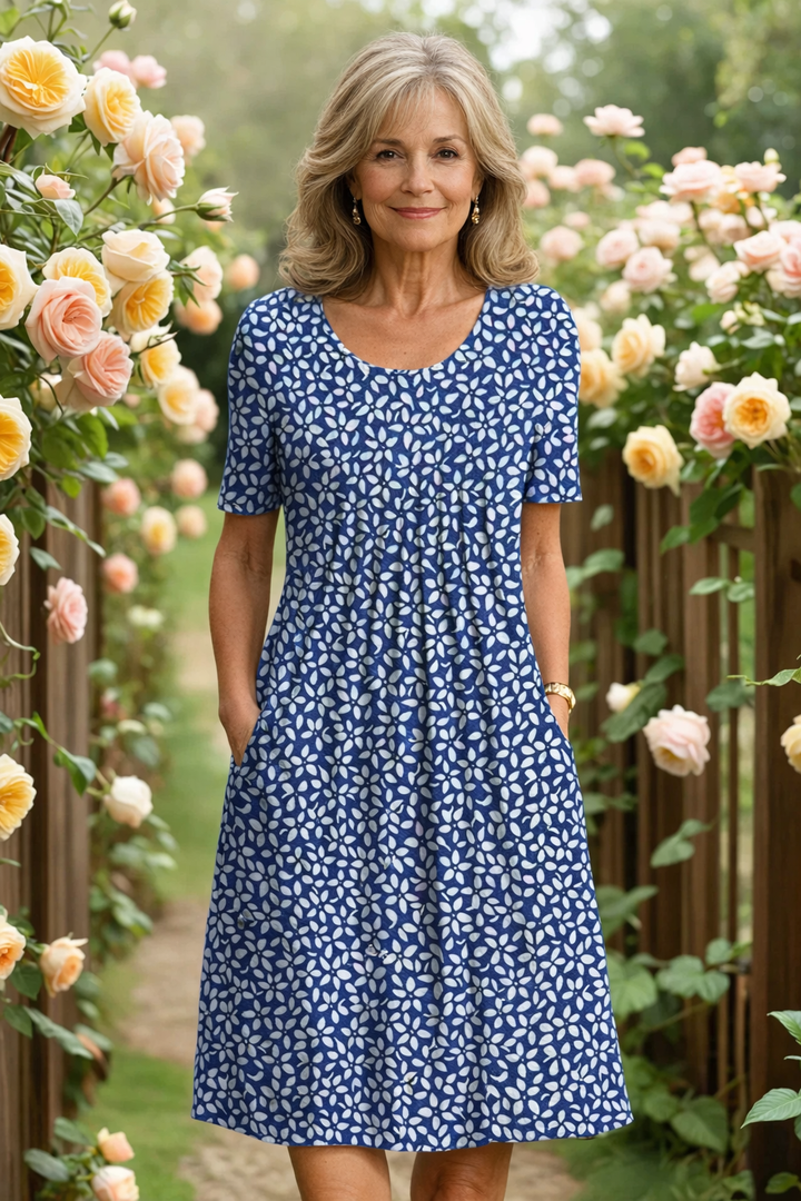 Elegant floral midi dress by Bennett and Lowe featuring a woman in a garden with roses.