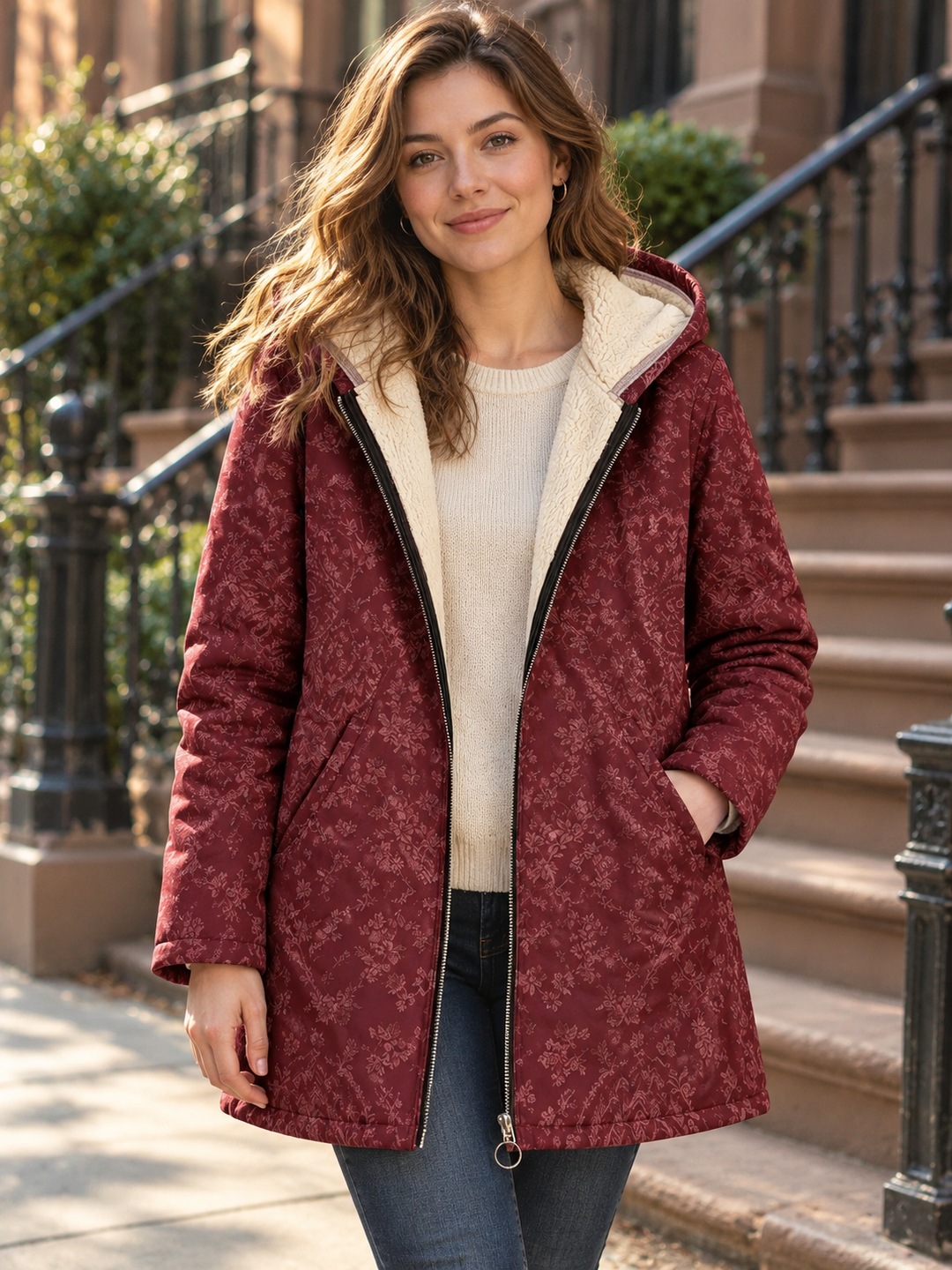 Warm brown floral hooded longline coat by Bennett & Lowe, shown in a winter portrait with a cozy, stylish design.