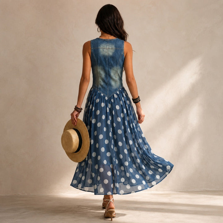 Polka-dot chiffon midi dress by Bennett and Lowe, featuring a flowing silhouette and classic pattern, displayed on a hanger.