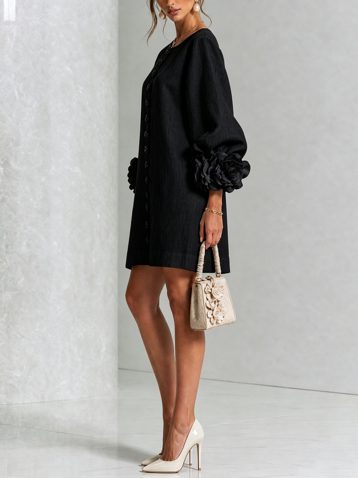 Black Henrietta™ Floral Button-Down Mini Dress by Bennett and Lowe, featuring a fitted silhouette and floral print.