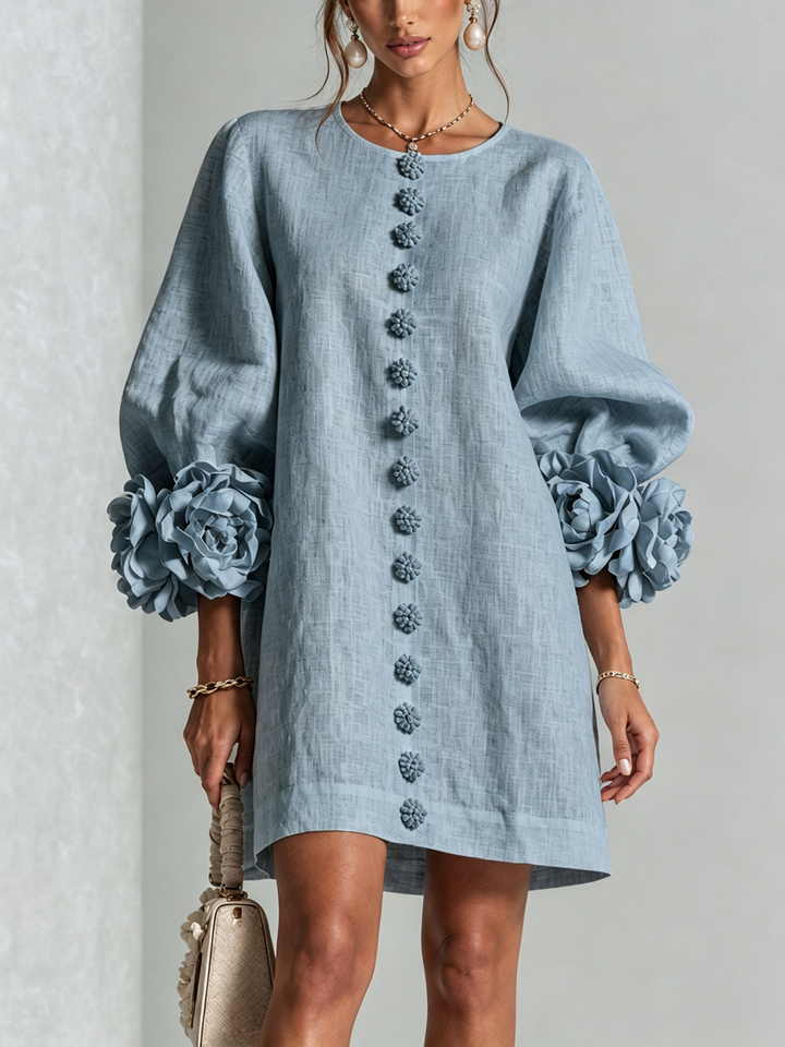 Henrietta™ Floral Button-Down Mini Dress by Bennett and Lowe in dusty blue with a floral pattern and long sleeves.