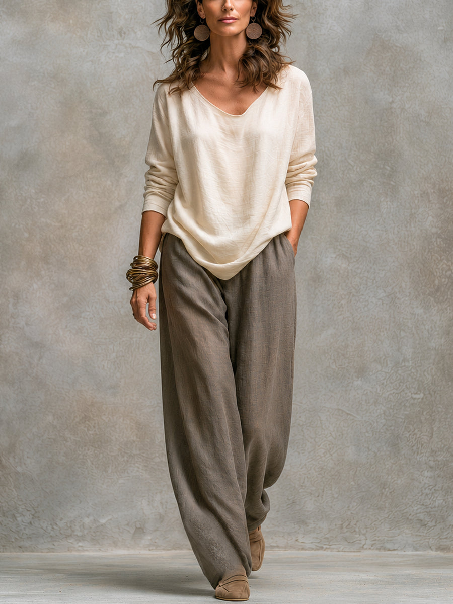 Simone Bennett and Lowe layered three-piece wide-leg matching set featuring a stylish top and flowy trousers.