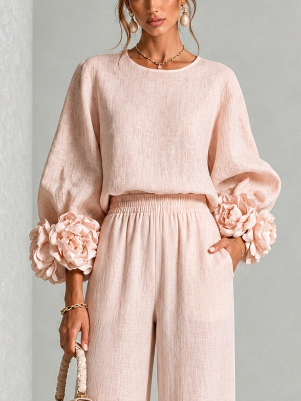 Pink Yolanda™ Ruffle Cuff Two-Piece Set by Bennett and Lowe, featuring ruffled sleeve cuffs and matching top and bottom pieces.