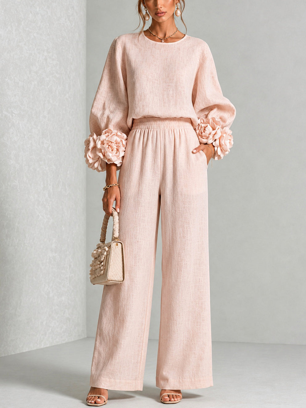 Pink Yolanda™ Ruffle Cuff Two-Piece Set by Bennett and Lowe, featuring ruffle details on the cuffs and a coordinated top and bottom.